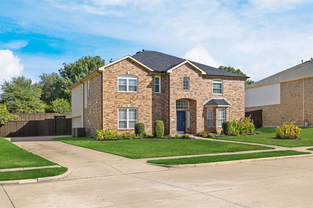Brick exterior with a dark roof and white trim Brick exterior with a dark roof and white trim