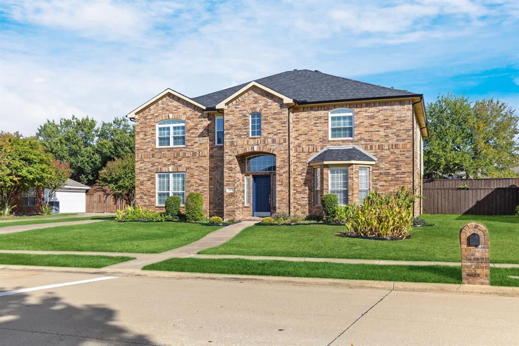 Brick exterior with a dark roof and multiple arched windows Brick exterior with a dark roof and multiple arched windows