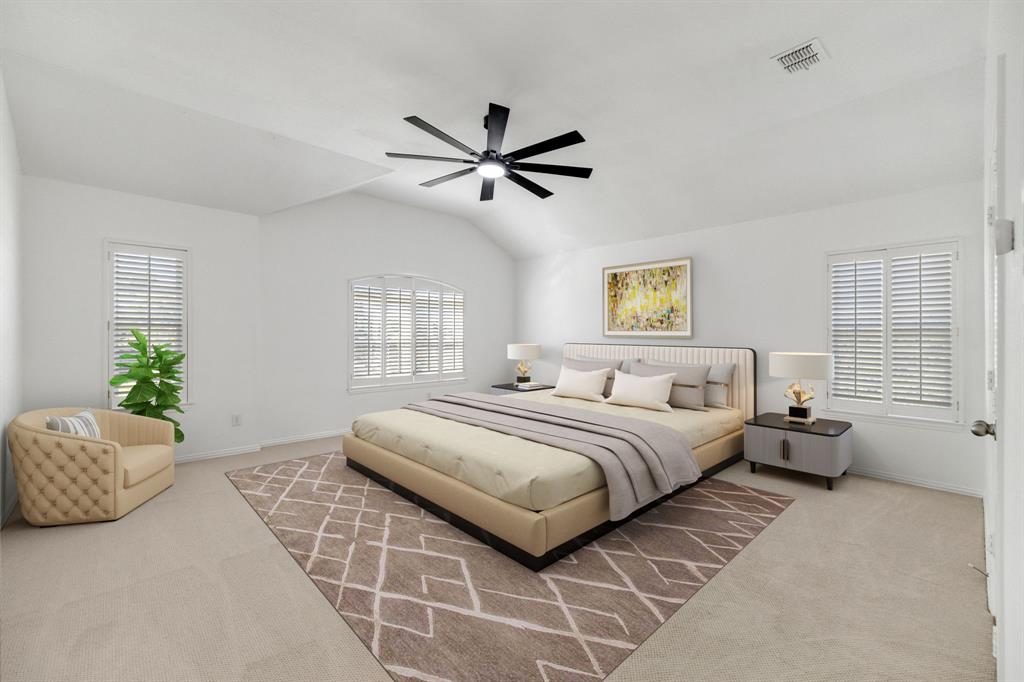 Vaulted ceiling with a contemporary ceiling fan, dual windows featuring plantation shutters, neutral-toned carpet flooring, and a white interior door