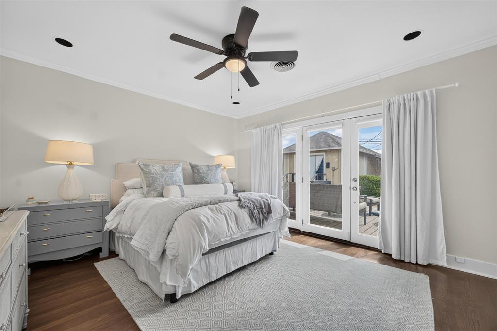 Recessed lighting, crown molding, ceiling fan, wood-finish flooring, and French doors leading to an outdoor space