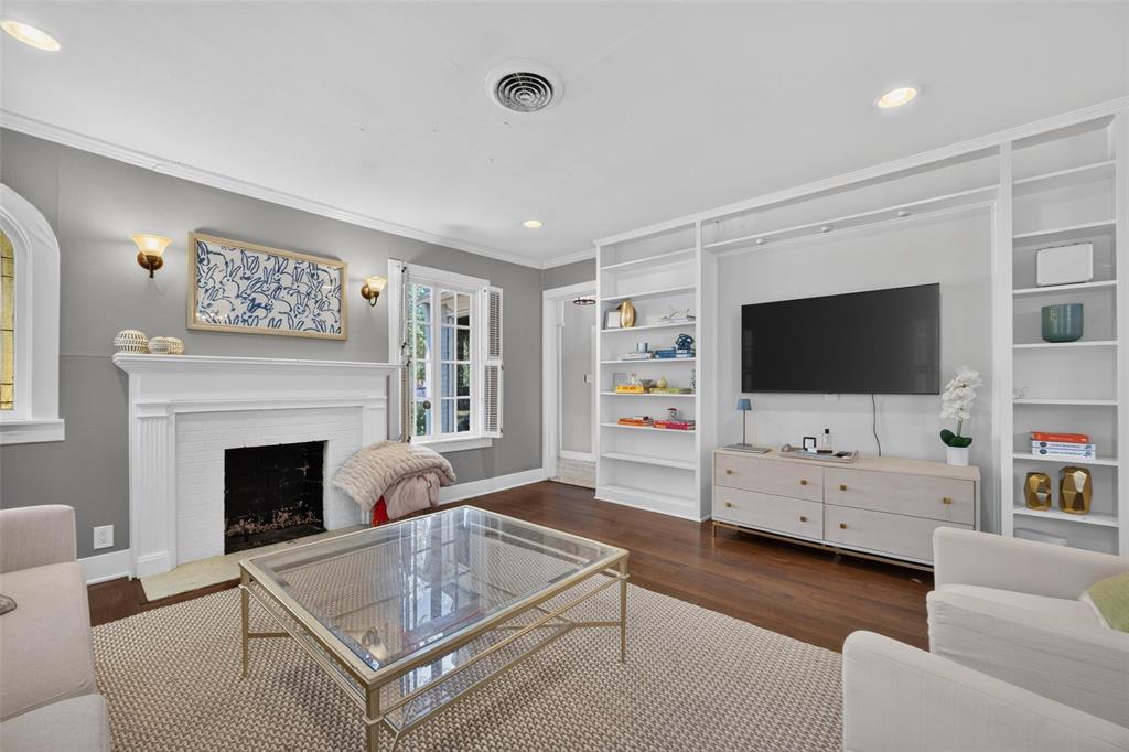 Hardwood-finish flooring complementing a white mantel and fireplace