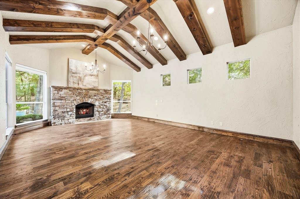 Huge Primary Retreat with fireplace & wood beamed ceilings