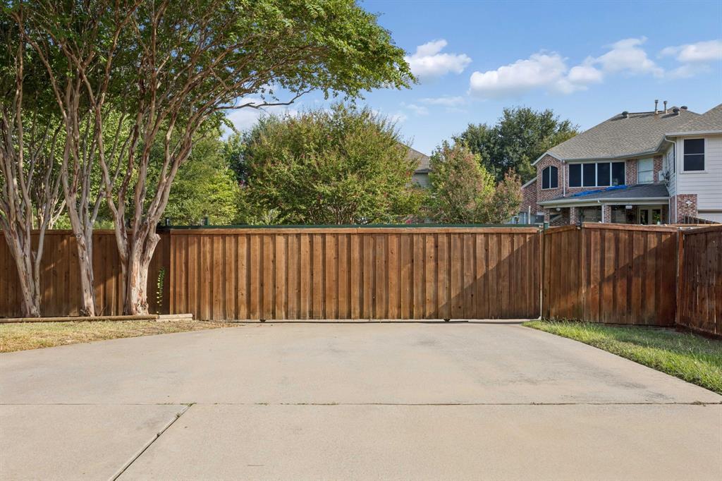 Sliding gate encloses the backyard