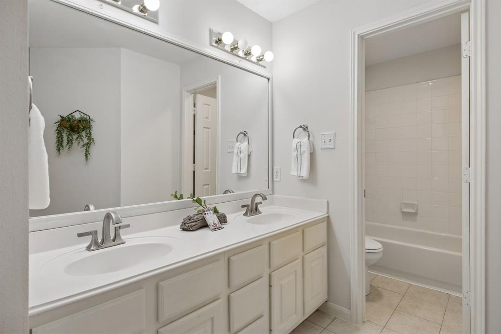 Secondary upstairs bath with double sinks
