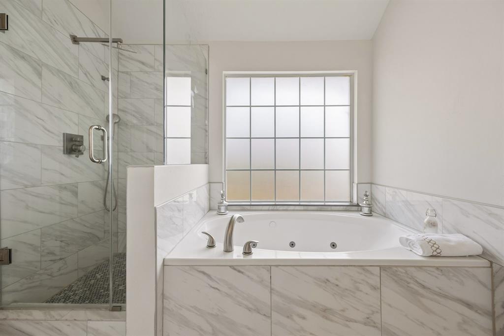Primary bath frameless shower and jet tub