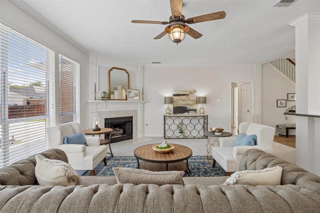 Gas fireplace and an abundance of natural light flow into the living room
