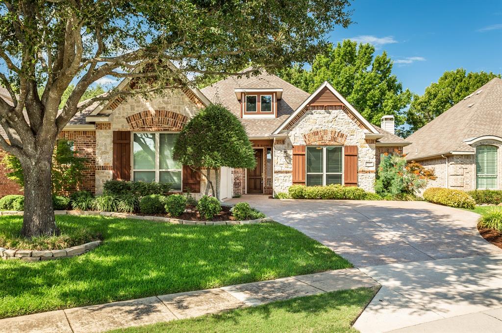 Brick and stone exterior with architectural shingles
