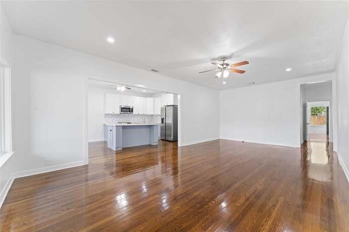 Hardwood flooring, recessed lighting, and a ceiling fan Hardwood flooring, recessed lighting, and a ceiling fan