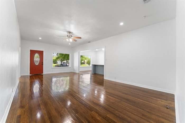 Wood-finish flooring, recessed lighting, and a ceiling fan