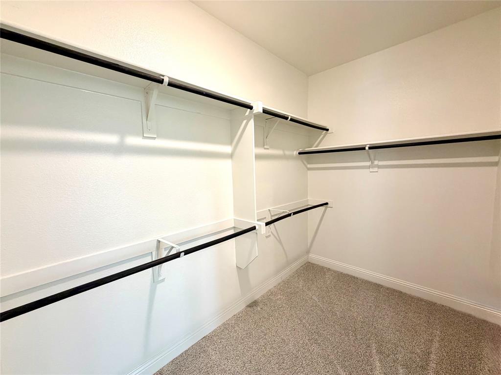 Spacious primary walk-in closet