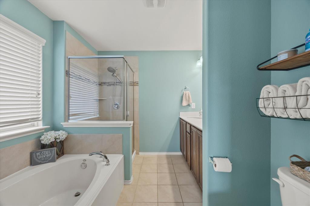 Soaking tub with deck-mounted faucet