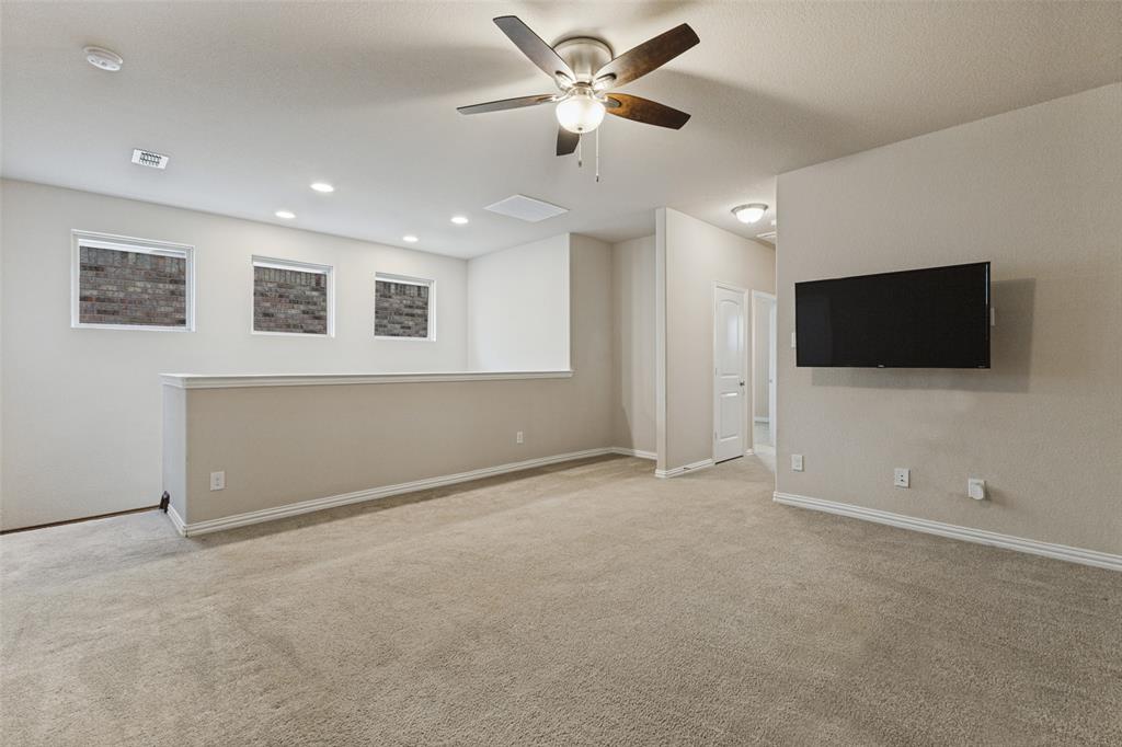 Oversized upstairs game room-living room with a ceiling fan, recessed lighting, and mounted TV