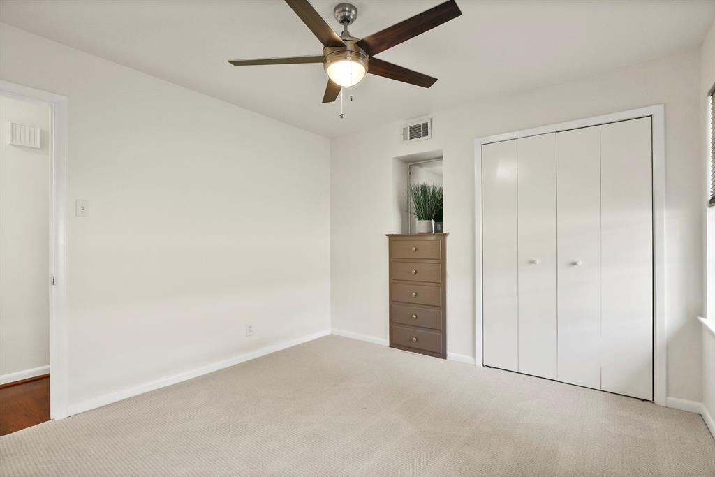 Light-colored carpeting with matching wall finishes