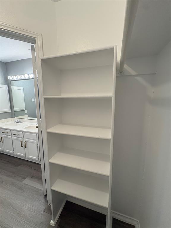 Built-in shelving unit with five white shelves