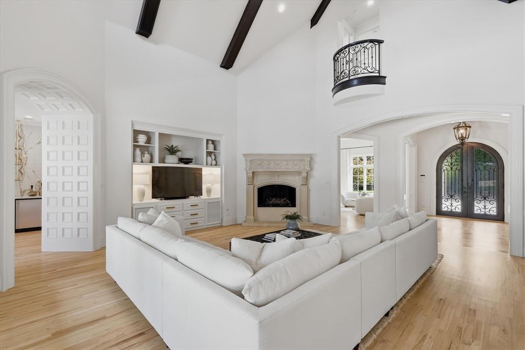 Refinished hardwood floors connect the family room to the kitchen, entry and surrounding living spaces. Refinished hardwood floors connect the family room to the kitchen, entry and surrounding living spaces.