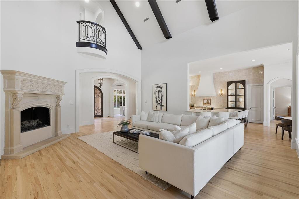 The family room's almost eight-foot cast-stone fireplace anchors the open living and entertaining spaces. The family room's almost eight-foot cast-stone fireplace anchors the open living and entertaining spaces.