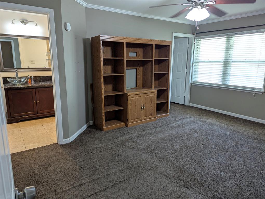 View 1: Primary suite features an ensuite bathroom, multiple closets, and an interior mechanical closet. Plenty of potential to personalize this space!