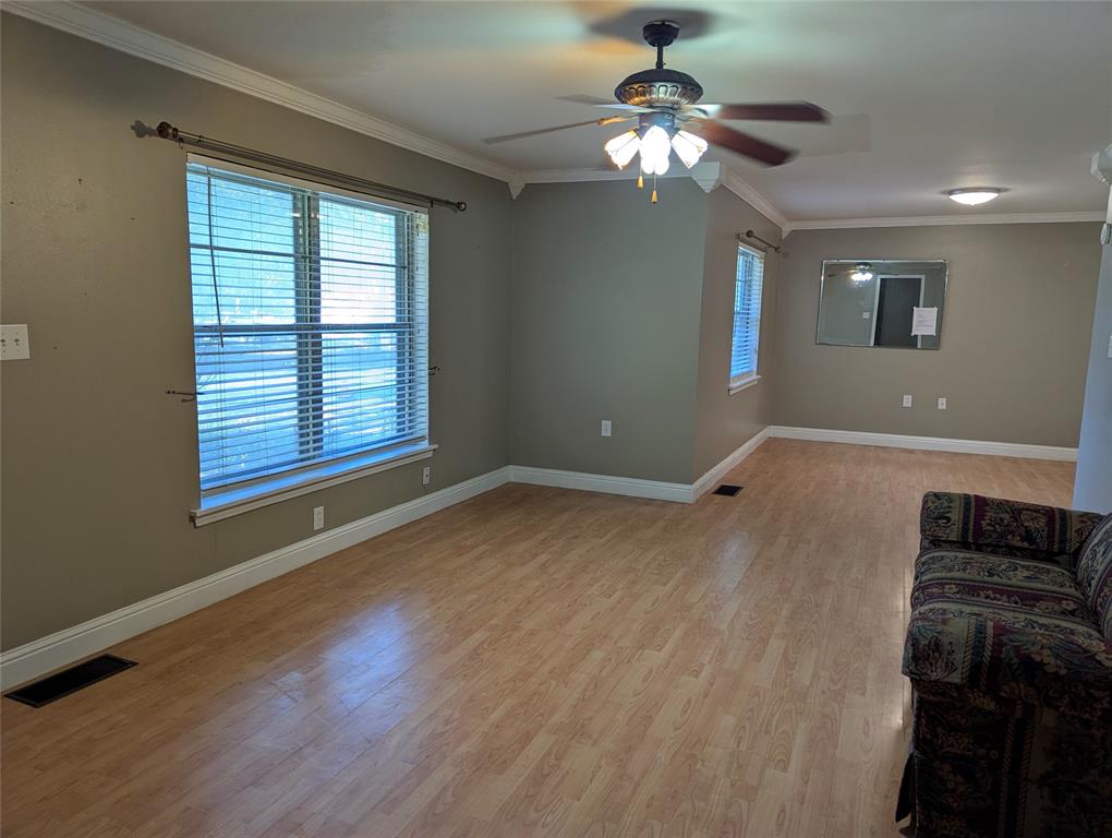 Opposite angle view of the living & dining rooms showing the space has the open view for family connections.