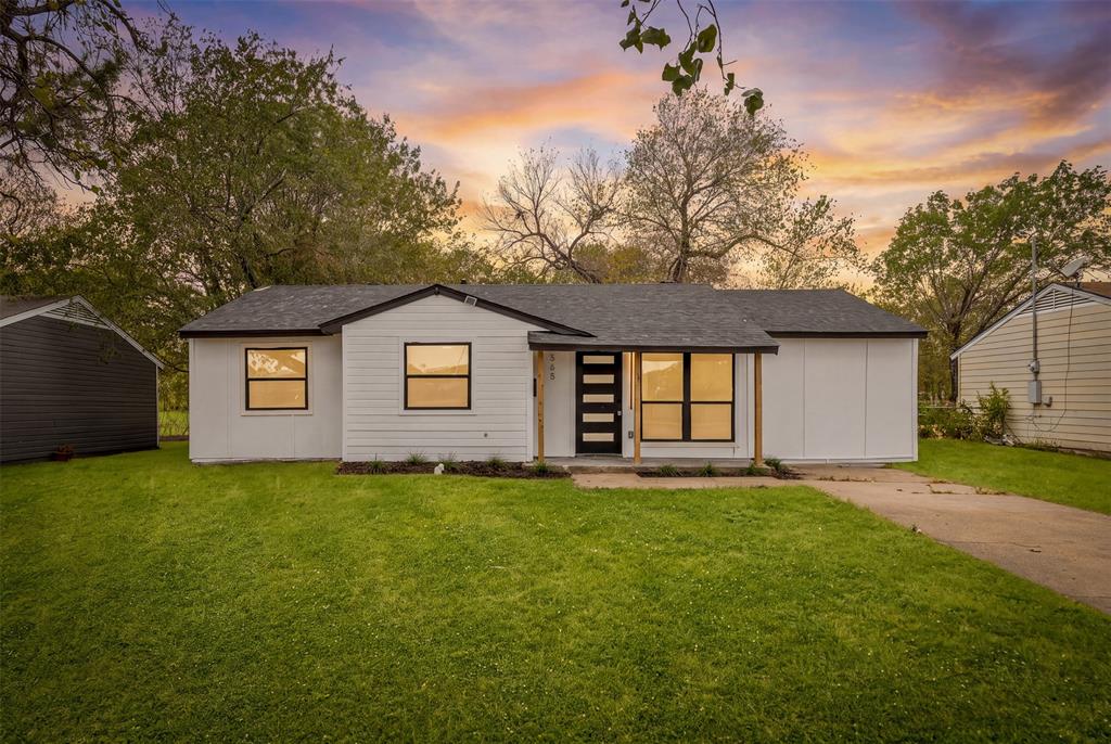 White exterior with dark trim, black shingle roof, and a contemporary front entry door with vertical glass inserts White exterior with dark trim, black shingle roof, and a contemporary front entry door with vertical glass inserts