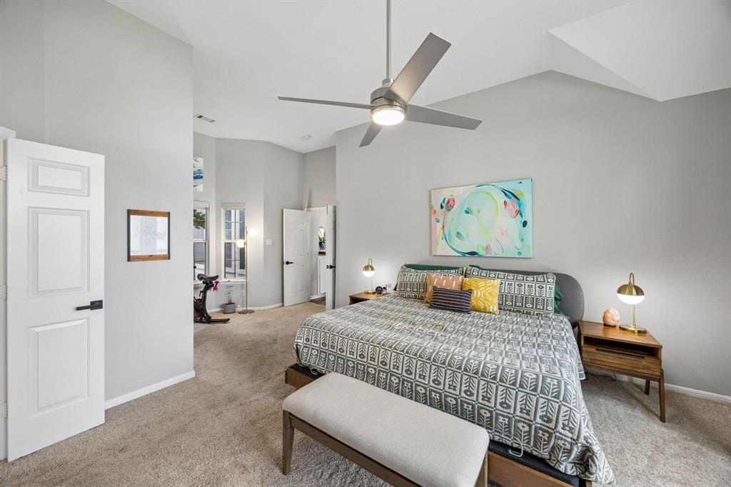 Vaulted ceiling with a contemporary ceiling fan, recessed lighting, and soft carpet flooring