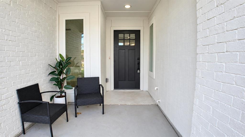 Covered entry with painted brick exterior