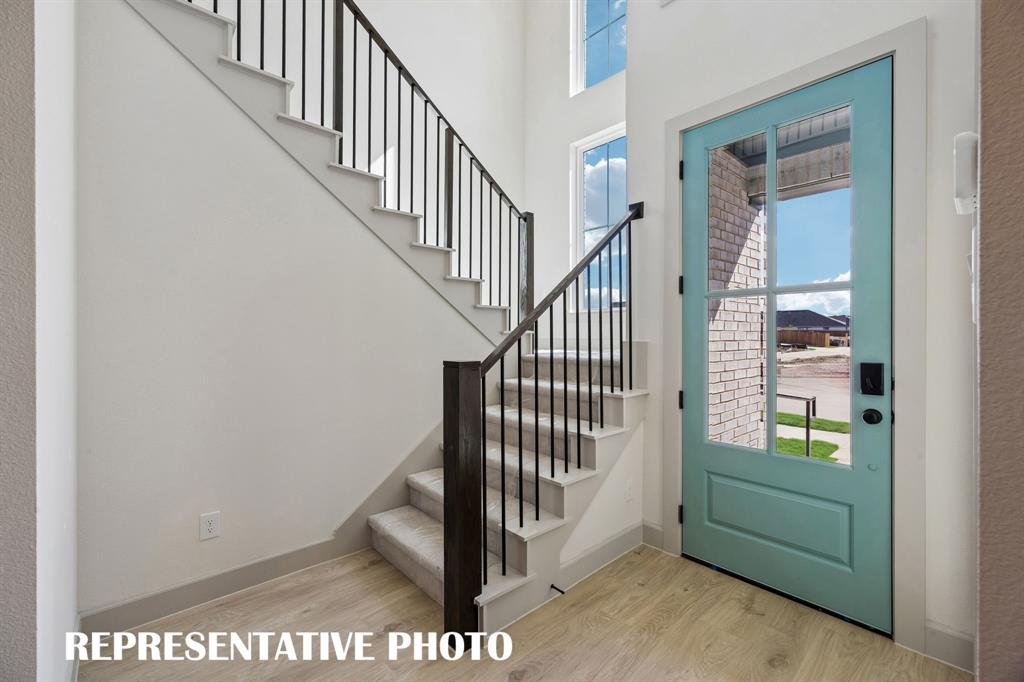 Featuring a charming covered front porch, glass and wood entry door and dramatic stair case, our Adelaide plan offers the perfect space for you to welcome friends and family into your dream home! REPRESENTATIVE PHOTO Featuring a charming covered front porch, glass and wood entry door and dramatic stair case, our Adelaide plan offers the perfect space for you to welcome friends and family into your dream home! REPRESENTATIVE PHOTO