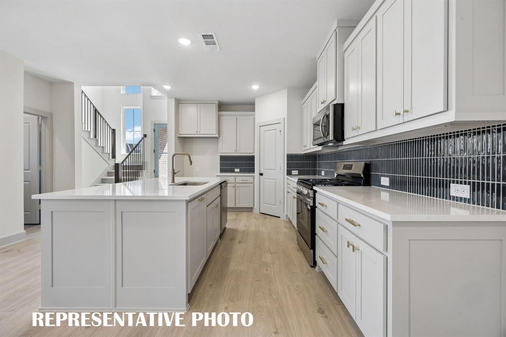 Beautiful cabinetry, gorgeous counter tops and stylish backsplash effortlessly pair with contemporary stainless steel to create a kitchen for the ages! REPRESENTATIVE PHOTO Beautiful cabinetry, gorgeous counter tops and stylish backsplash effortlessly pair with contemporary stainless steel to create a kitchen for the ages! REPRESENTATIVE PHOTO