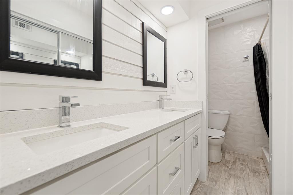 Dual rectangular undermount sinks set in a light-toned countertop