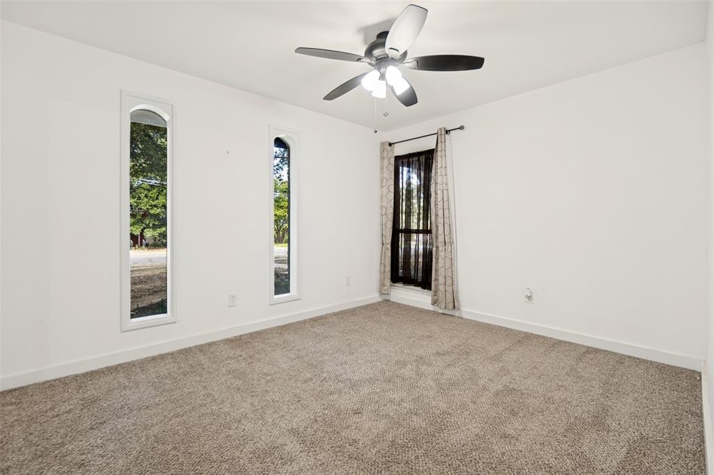 Neutral tone carpeting complements the white walls