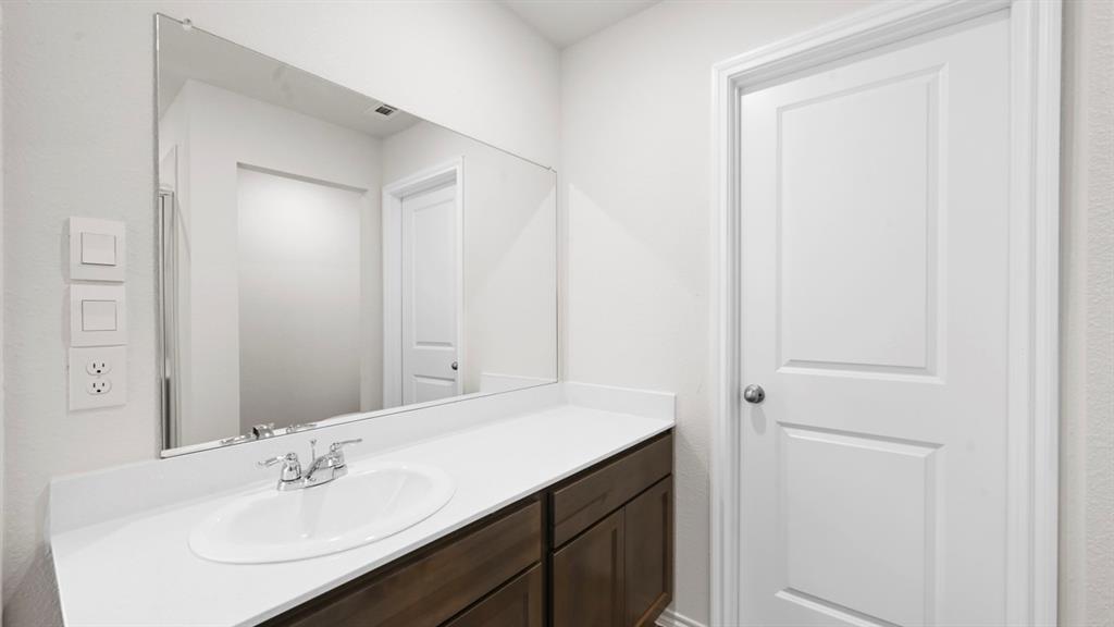 White countertop with an integrated sink and chrome faucet