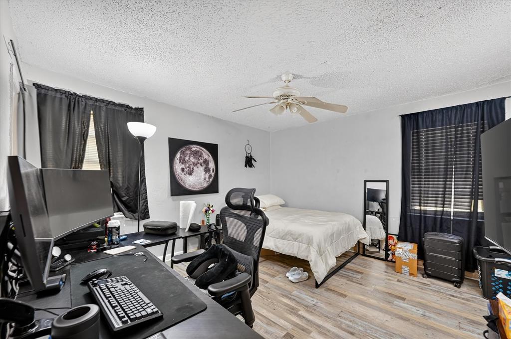 Wood-finish flooring throughout the room