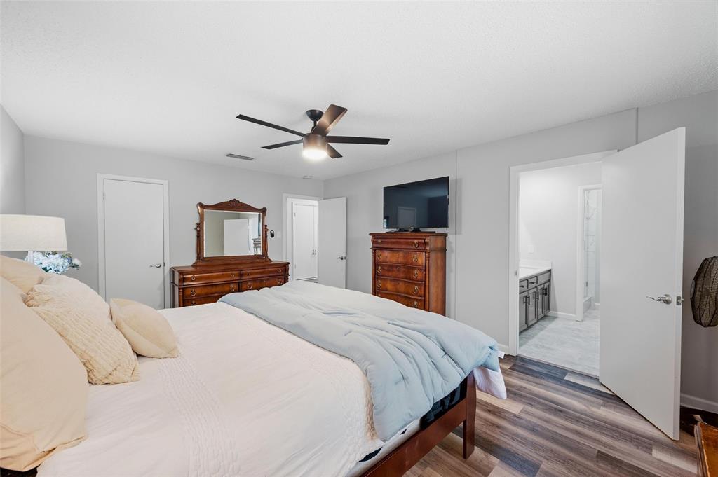Wood-finish flooring, ceiling fan, and recessed lighting