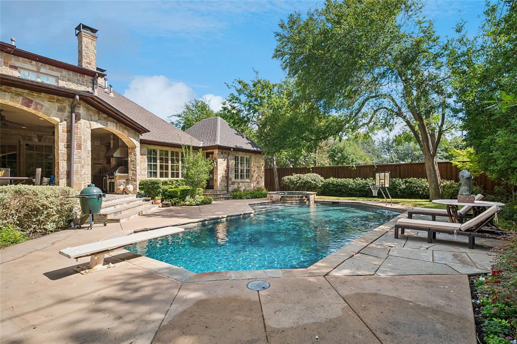 Stone exterior with a covered patio and arched openings Stone exterior with a covered patio and arched openings