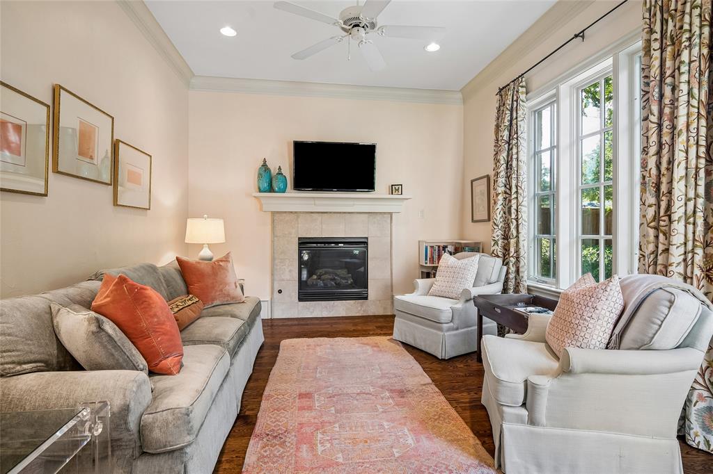 Secreted off the primary bedroom you’ll find this lovely private space to relax. Featuring hardwood finish flooring, a fireplace with a stone surround and views of pool and spa