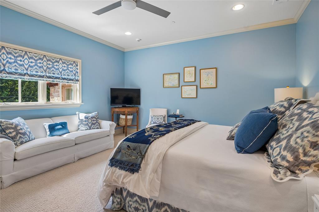 Bedroom suite #6 Recessed lighting, crown molding, ceiling fan, window with patterned shade, and wall-mounted sconce