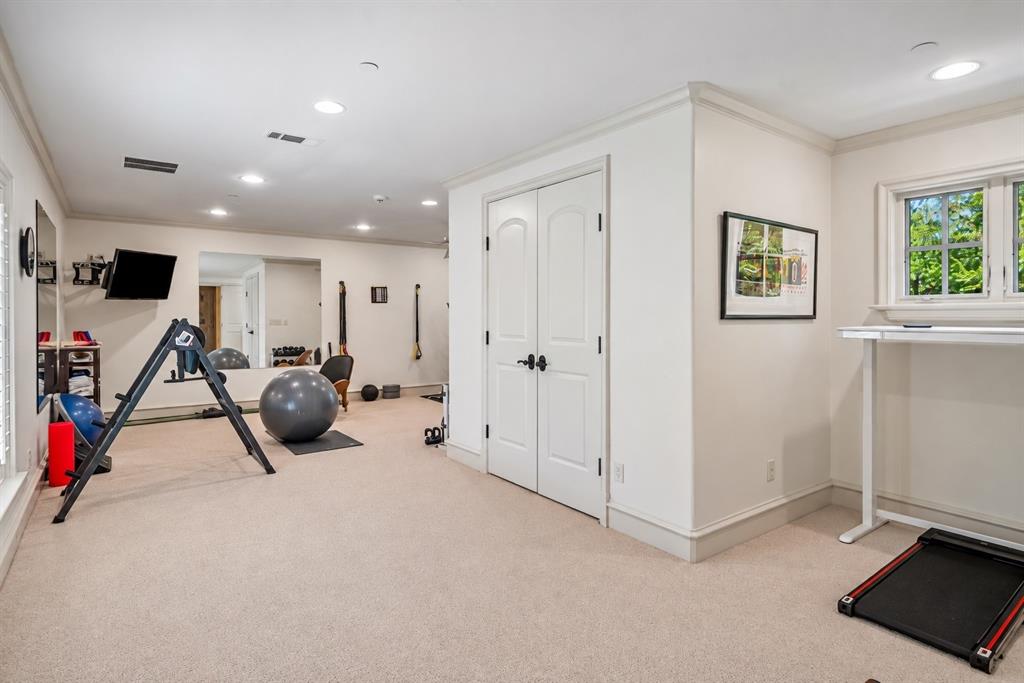 Generous 2nd floor exercise room/gym complete with a full bath and steam shower offering the potential to serve as a private wellness get-a -way.