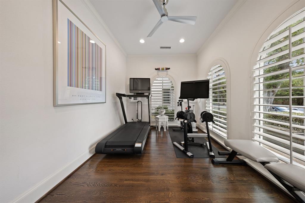 Wood-finish flooring, recessed lighting, and a ceiling fan