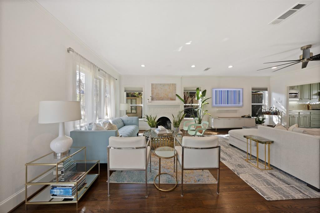 Hardwood flooring, recessed lighting, and crown molding