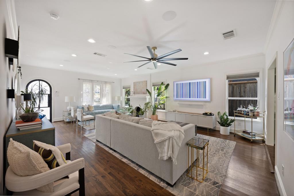 Hardwood flooring, recessed lighting, and a contemporary ceiling fan
