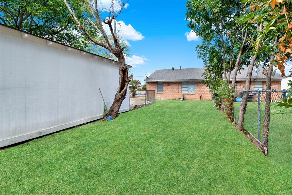 Note, fence down the middle of the lot provides for separate back yard.