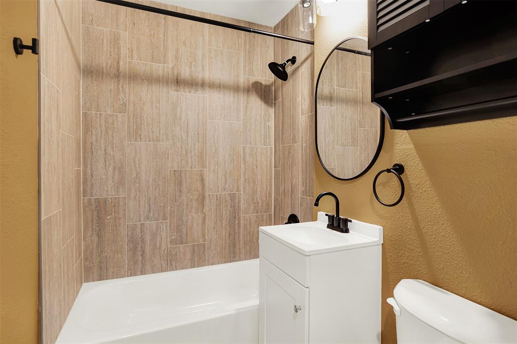 Everything Brand new..Full bathroom with tiled shower / bath, vanity, and toilet Everything Brand new..Full bathroom with tiled shower / bath, vanity, and toilet