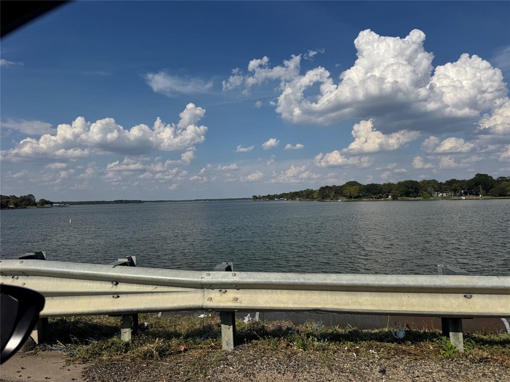 Expansive water frontage with mature trees along the shoreline