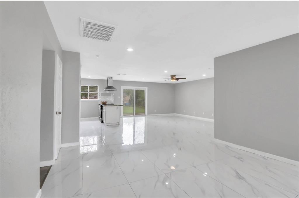 Entrance view from front door.  Large open concept with 2 living spaces and a dining area.