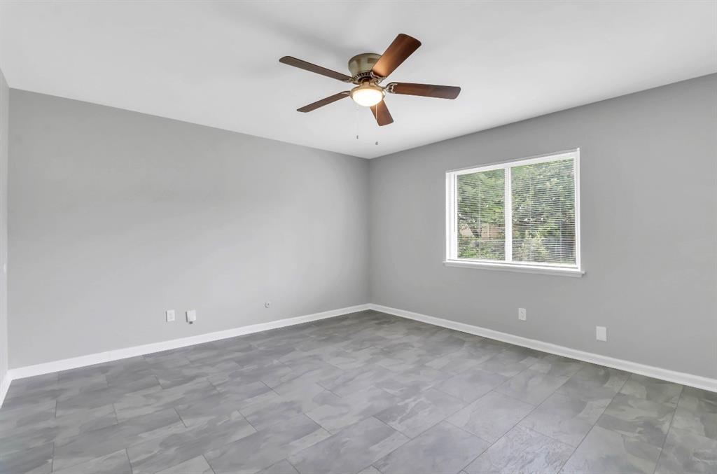 Neutral gray walls complementing gray tile flooring