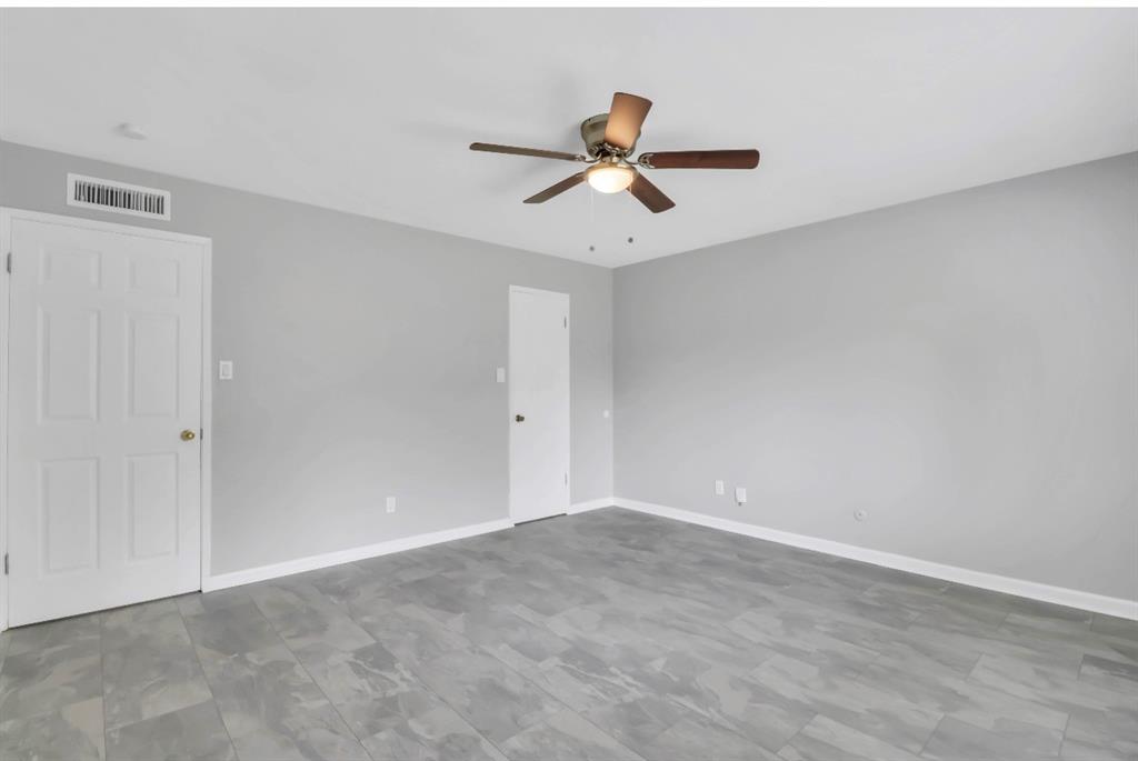 Main bedroom area with large walk-in closet and ensuite full bathroom.