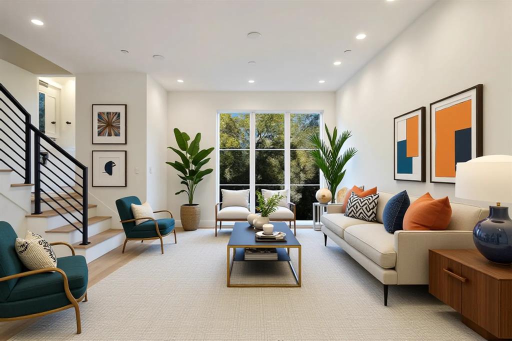 Expansive windows, light wood-finish flooring, recessed lighting, and a modern staircase with black metal railings
