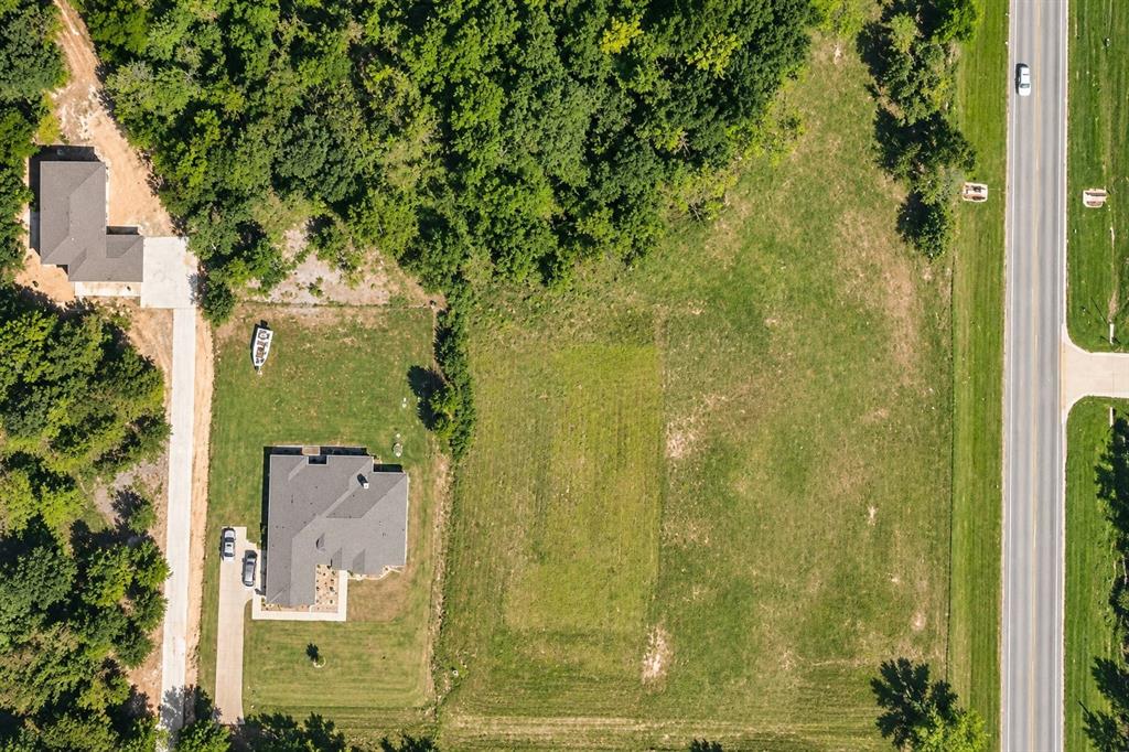 Expansive lot with a single-story residence and a detached garage structure