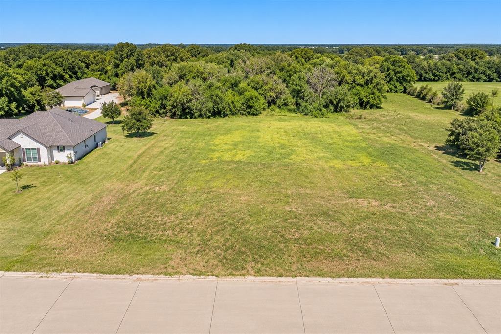 Expansive undeveloped lot with a partial concrete curb and street frontage