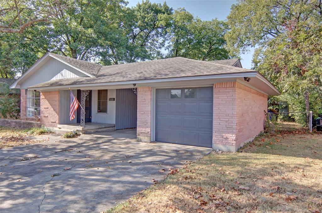 Brick exterior with a gabled roofline and attached garage Brick exterior with a gabled roofline and attached garage