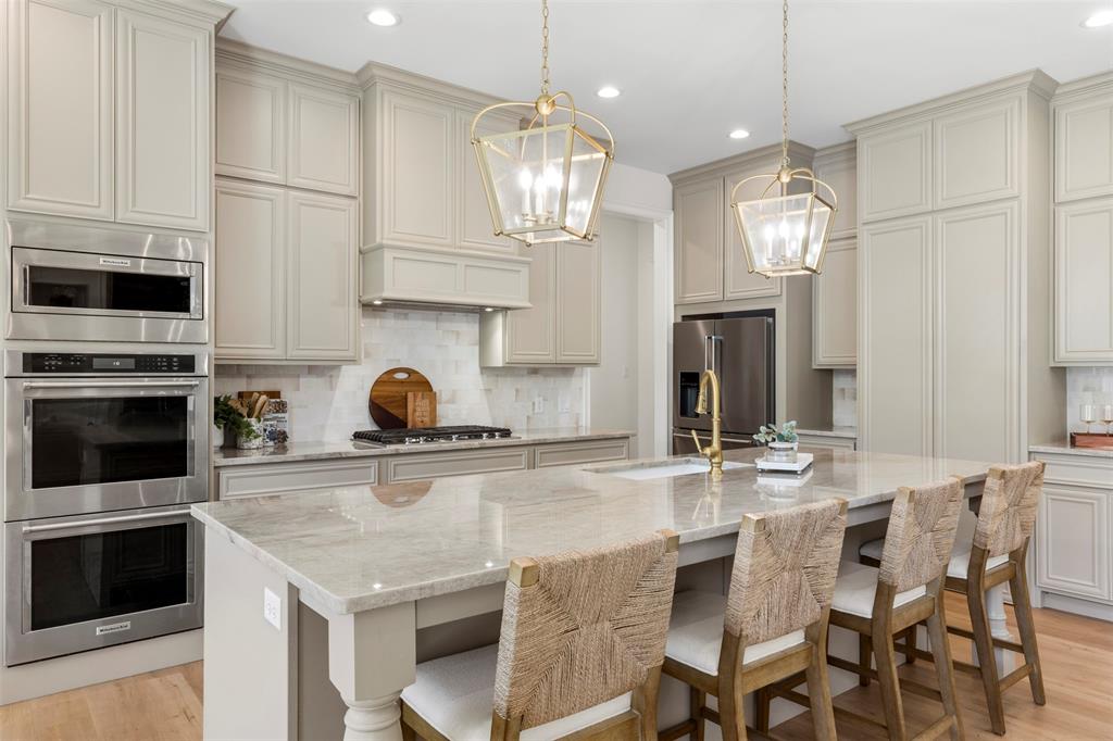Taj Mahal Quartzite countertops. Double ovens
